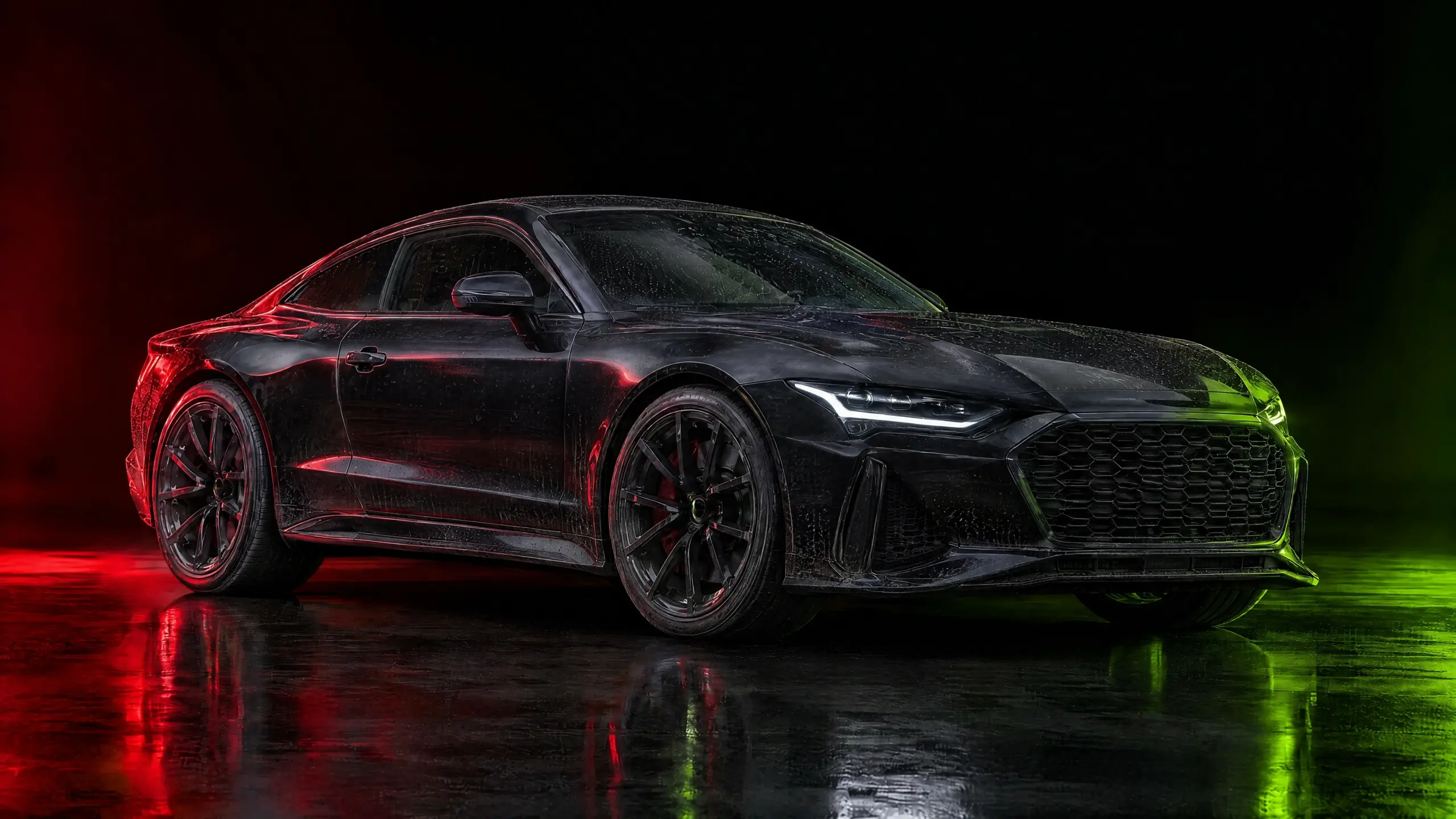 Black performance car before detailing